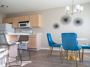 Webster townhouse for rent - a kitchen and dining room with a table and chairs