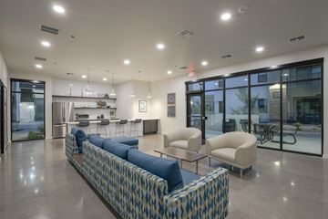Phoenix apartment for rent - a lobby with couches and chairs and a kitchen