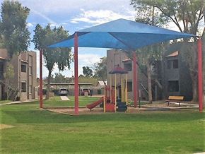 Phoenix apartment for rent - a playground with a blue canopy in a park