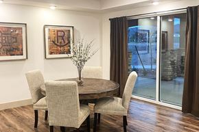 Phoenix apartment for rent - a dining room with a table and chairs and sliding glass doors
