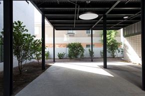 Mesa apartment for rent - a courtyard with trees and a light hanging from the ceiling