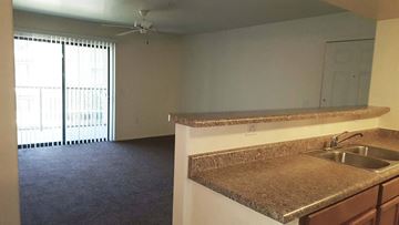 Phoenix apartment for rent - an empty kitchen with granite counter tops in an empty room