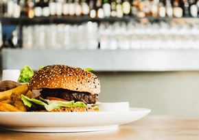 Tempe apartment for rent - a plate with a hamburger and fries on a table