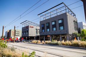 Mesa apartment for rent - a building that is sitting on the side of the tracks