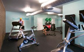 Mesa apartment for rent - a group of people in a gym with exercise equipment