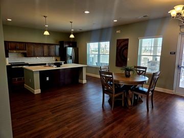 Apache Junction apartment for rent - A kitchen with a table and chairs in front of a window.