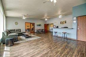 Phoenix apartment for rent - the living room and kitchen of a house with a wood floor
