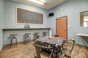 Phoenix apartment for rent - a dining room with a table and a chalkboard on the wall