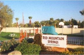 Phoenix apartment for rent - a red mountain springs park with a playground and a sign