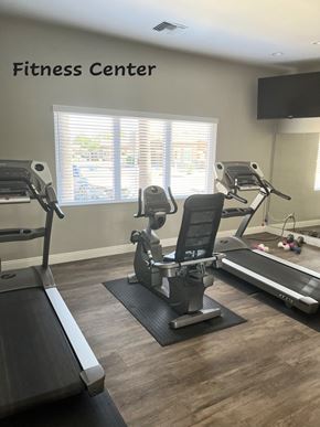 Sun City West apartment for rent - A fitness center with treadmills, elliptical machines, and a stationary bike.