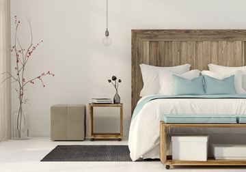 Glendale apartment for rent - A bedroom with a large bed and a wooden headboard.