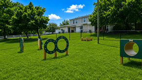 Raleigh townhouse for rent - A playground with a slide and a green sign with a yellow circle on it.