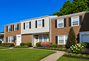 Raleigh townhouse for rent - A brick house with a white door and windows.