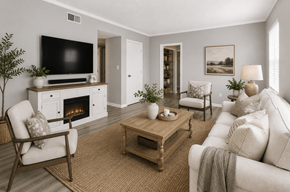 Charlotte apartment for rent - A living room with a fireplace, a chair, a couch, and a coffee table.