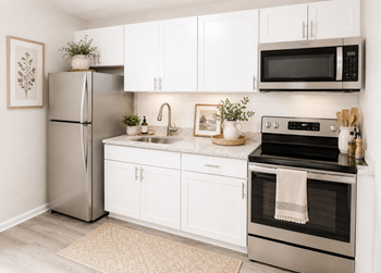 Upgraded kitchen with white cabinetry