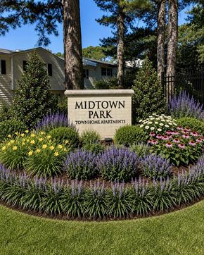 Raleigh townhouse for rent - A sign that says Midtown Park in front of some flowers.