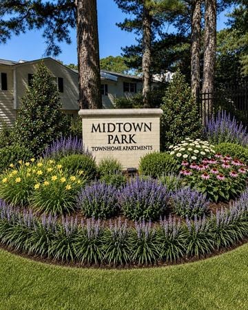 Raleigh townhouse for rent - A sign that says Midtown Park in front of some flowers.
