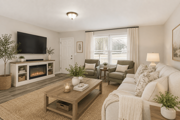Gastonia apartment for rent - A living room with a fireplace and a television on the wall.
