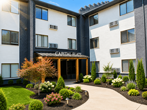 Raleigh apartment for rent - The front of the Capital Flats building is shown with a landscaped garden in the foreground.