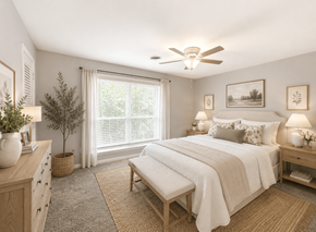 Raleigh townhouse for rent - A bedroom with a bed, nightstand, and window.