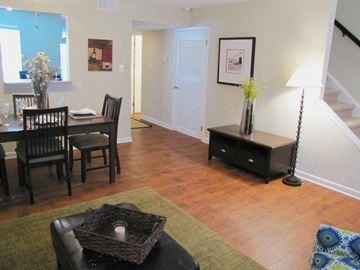 Raleigh townhouse for rent - a living room and dining room with a table and chairs