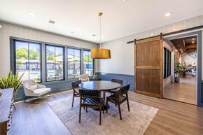 Concord apartment for rent - A dining room with a round table and chairs.at Evolve at Parkway Apartment Homes, Concord North Carolina