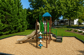 Charlotte apartment for rent - A playground with a slide, swings, and a playhouse.