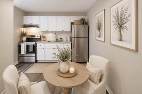 Durham apartment for rent - A modern kitchen with a dining table set for two.