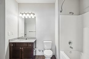Lebanon apartment for rent - A white bathroom with a toilet, sink, and a mirror at Venue at 109 Apartments, Lebanon , TN, 37090
