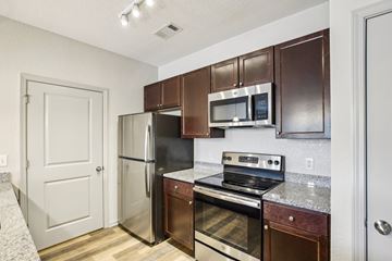 Lebanon apartment for rent - A kitchen with brown cabinets and stainless steel appliances.