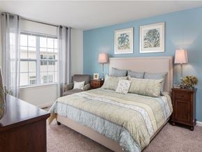 Hillsborough apartment for rent - A bedroom with a large bed and two lamps.