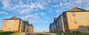 Claremore apartment for rent - Apartment buildings with a road in front of them.