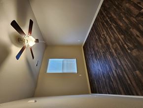 Claremore apartment for rent - A ceiling fan in a room with a window.