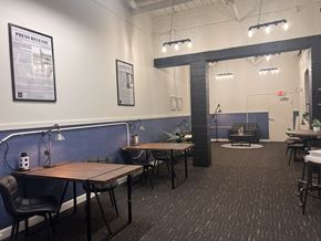 Lancaster apartment for rent - A room with a long table and chairs, a couch, and a poster on the wall.