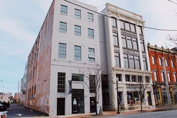 Lancaster apartment for rent - A street view of a building with a tree in front of it.
