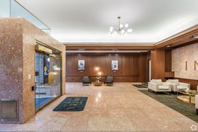 Lancaster apartment for rent - A lobby with a marble floor and a chandelier.