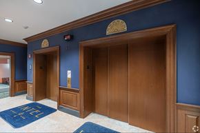 Lancaster apartment for rent - A hallway with blue walls and wooden doors.