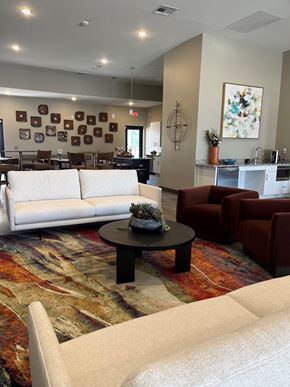 Shepherdsville townhouse for rent - A living room with a white couch, a coffee table, and a rug.