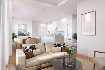 Miami apartment for rent - A modern living room with a large sofa and a coffee table.