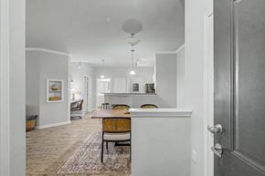 Richmond Hill apartment for rent - A kitchen with a table and chairs in the middle of the room.