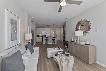 San Antonio apartment for rent - A modern living room with a white couch and a wooden floor.