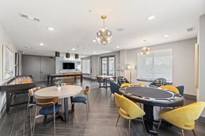 Cedar Hill apartment for rent - A modern dining room with a large table and chairs at The Preserve at Preston Trails Apartments, Cedar Hill
