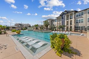 San Antonio apartment for rent - Pool Surrounded by Chairs at Citadel at Westpointe Apartments, San Antonio
