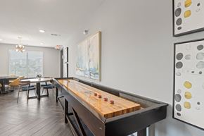 Cedar Hill apartment for rent - A shiny wooden pool table in a room with a painting on the wall at The Preserve at Preston Trails Apartments, Cedar Hill 75104