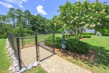 A black fence with a gate