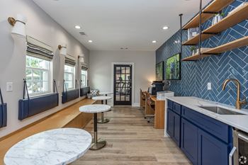 Kitchen with a blue backsplash 