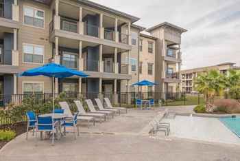 Pool area with lounge chairs