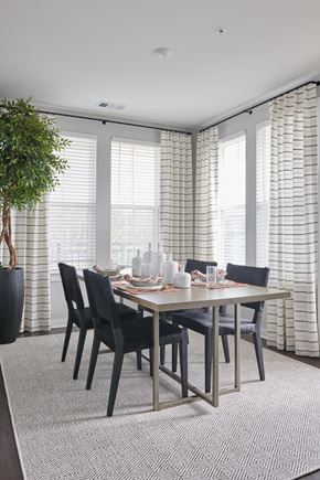 Mableton townhouse for rent - A dining room with a table set for six.