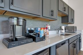 Clarksville apartment for rent - A kitchen with a coffee maker and a microwave on the counter.at Arrowood Farms, Tennessee, 37042