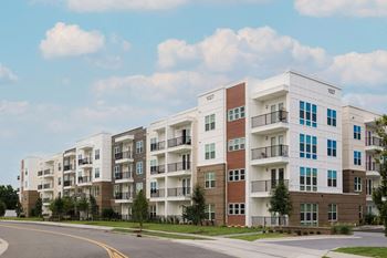 Apartment building with balconies and multiple windows